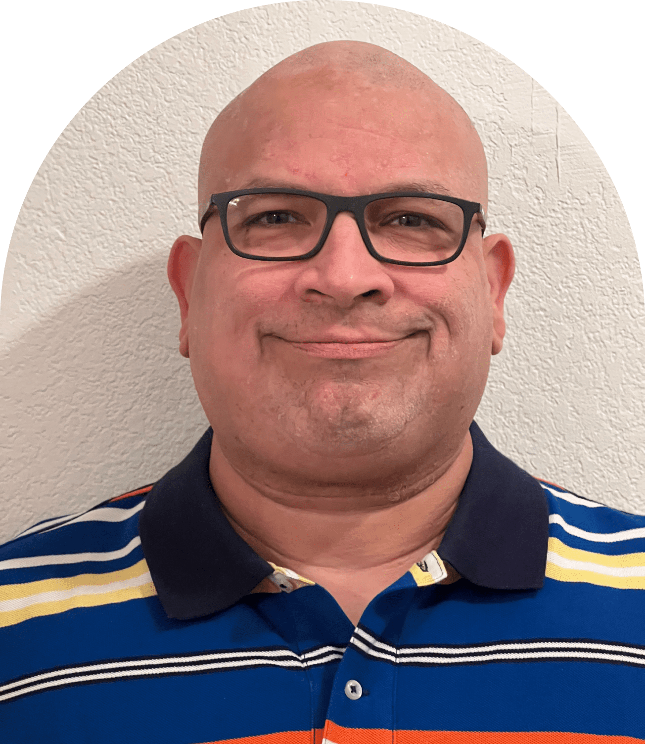 Smiling bald man wearing glasses and striped shirt
